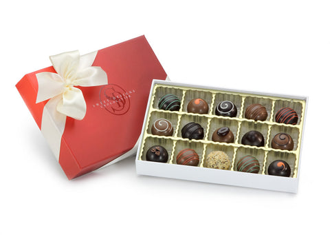 15 pieces of chocolate truffles in a gift box with a bow