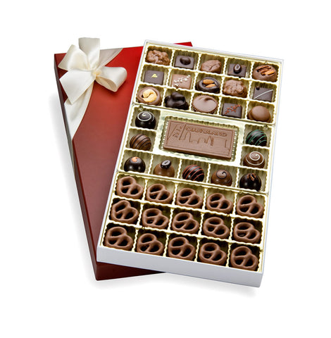 A box of assorted chocolates with a chocolate message bar