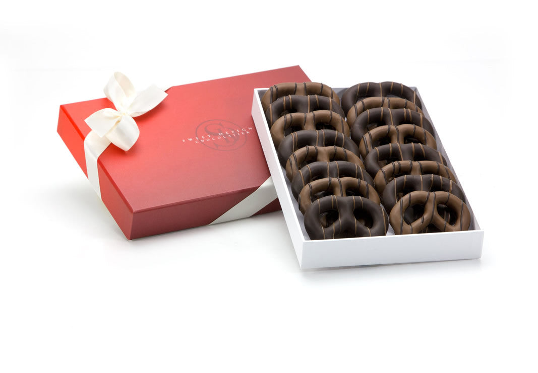 16 milk and dark chocolate-covrered pretzels in a gift box