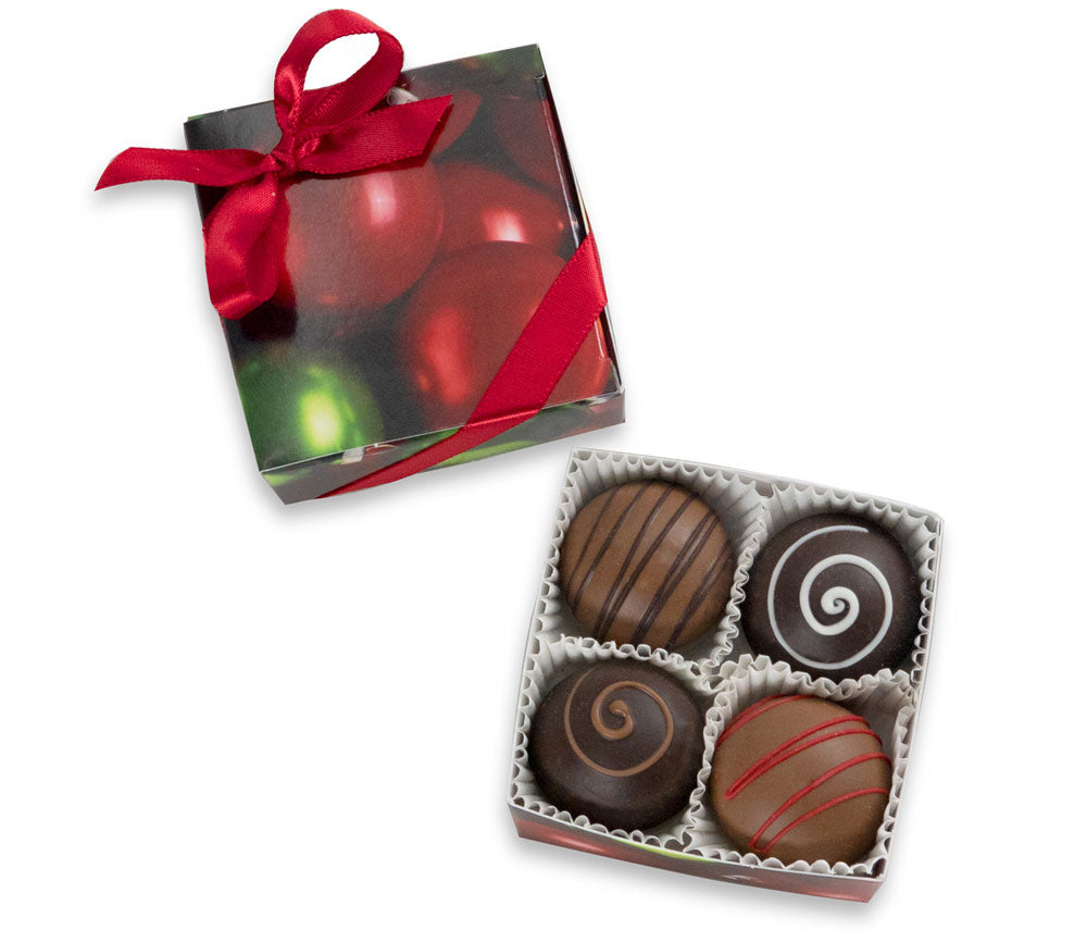 Four truffles in Christmas packaging