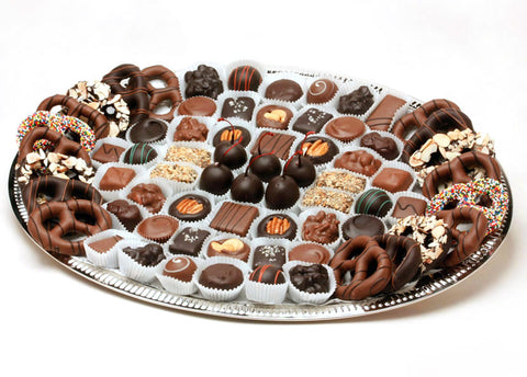 Tray with an assortments of chocolates and chocolate-covered pretzels