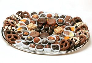 Tray with chocolates, chocolate-covered pretzels and oreos