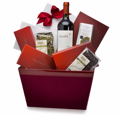 A gift basket with assorted chocolates and a bottle of wine