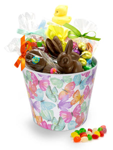 A bucket decorated with butterflies, filled with Easter chocolates