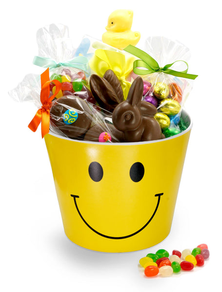 A smiley-face bucket filled with Easter chocolates and treats