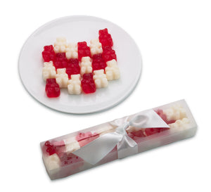 Red and white gummy bears in a Valentine gift box with a bow