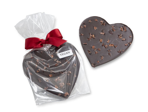 A vegan, organic 70% dark chocolate Valentine heart topped with cocoa nibs