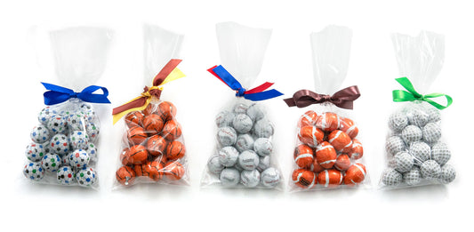 Soccer, basketball, baseball, football and soccer milk chocolate balls