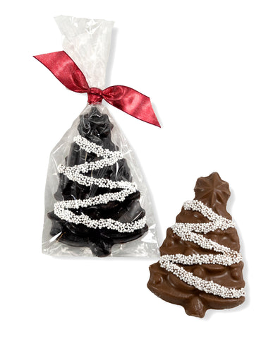 Milk and dark chocolate Christmas trees, festively decorated with nonpareils and a ribbon